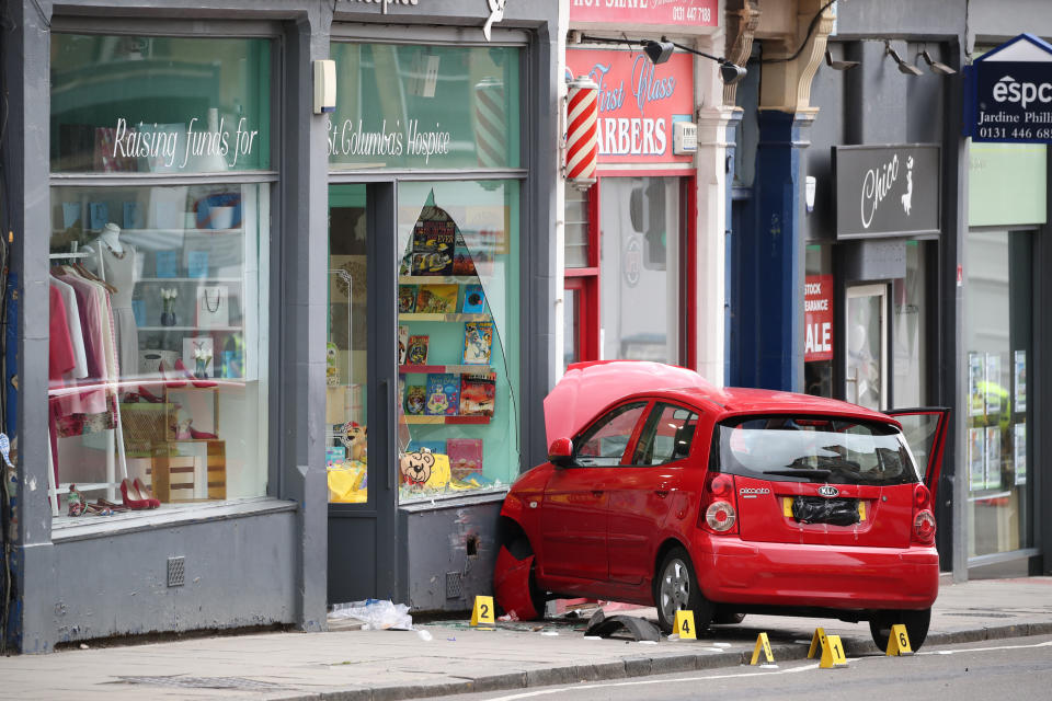 The car which struck Xander Irvine and crashed into a shop in Edinburgh. (PA)