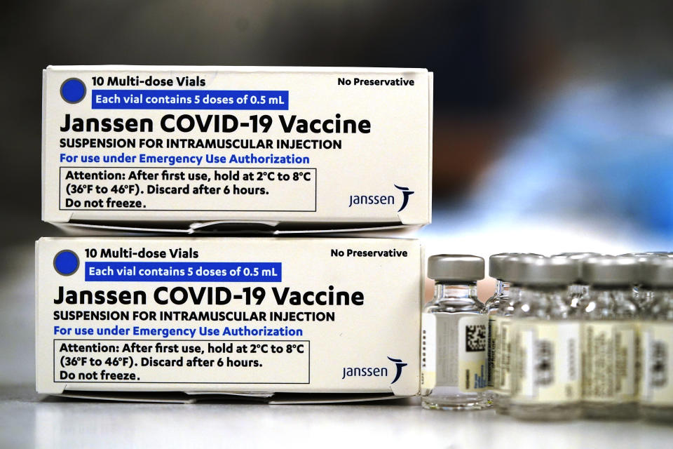 FILE - In this March 6, 2021 file photo, boxes containing the Johnson & Johnson COVID-19 vaccine sit next to vials in the pharmacy of National Jewish Hospital for distribution, in east Denver. A panel of U.S. health advisers endorsed booster doses of Johnson & Johnson’s single-shot COVID-19 vaccine Friday, Oct. 15, saying they should be offered at least two months after immunization. (AP Photo/David Zalubowski, File)