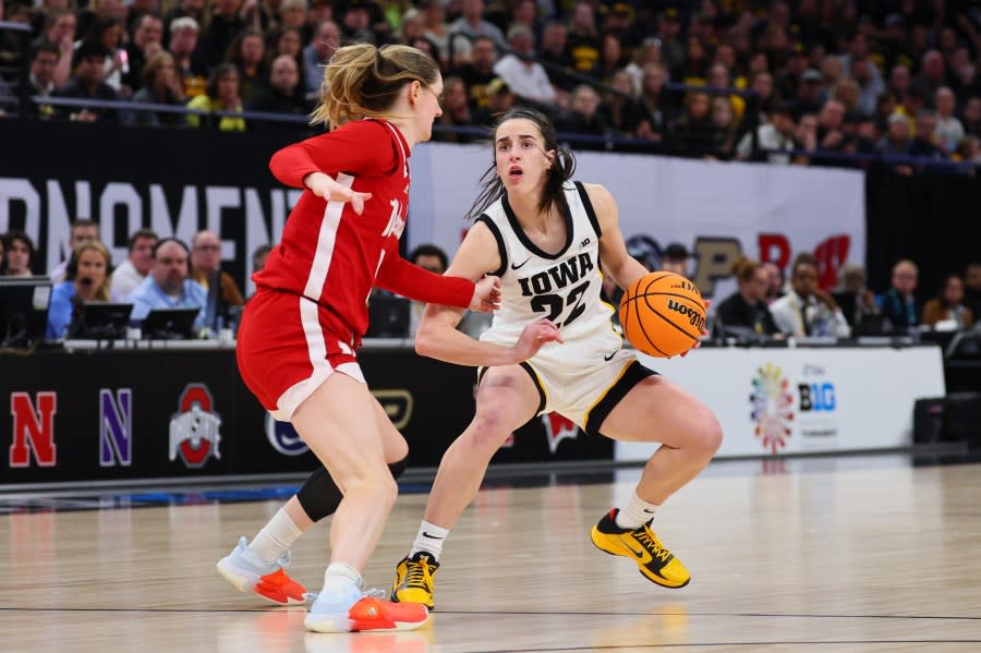 Caitlin Clark #22 of the Iowa Hawkeyes dribbles against Kendall Moriarty #15 of the Nebraska Cornhuskers in the second half during the Big Ten Women’s Basketball Tournament Championship at Target Center on March 10, 2024 in Minneapolis, Minnesota. (Photo by Adam Bettcher/Getty Images)