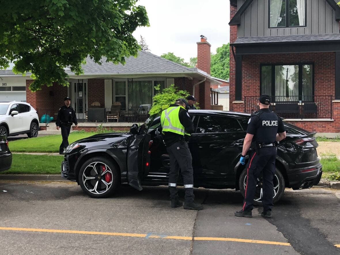 Toronto police say a car was recovered in the city's west end Thursday after a home invasion in the Fort York Boulevard and Spadina Avenue area. (Clara Pasieka/CBC - image credit)