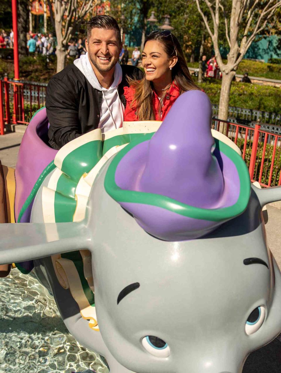 Tim Tebow and fiancée Demi-Leigh Nel-Peters take flight on Dumbo at Magic Kingdom Park at Walt Disney World Resort while celebrating their recent engagement with family and friends on January 11, 2019 in Lake Buena Vista, Florida