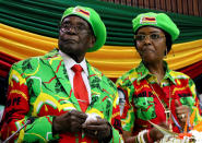 <p>Zimbabwean President Robert Mugabe and his wife Grace attend a meeting of his ruling ZANU PF party’s youth league in Harare, Zimbabwe, Oct. 7, 2017. (Photo: Philimon Bulawayo/Reuters) </p>