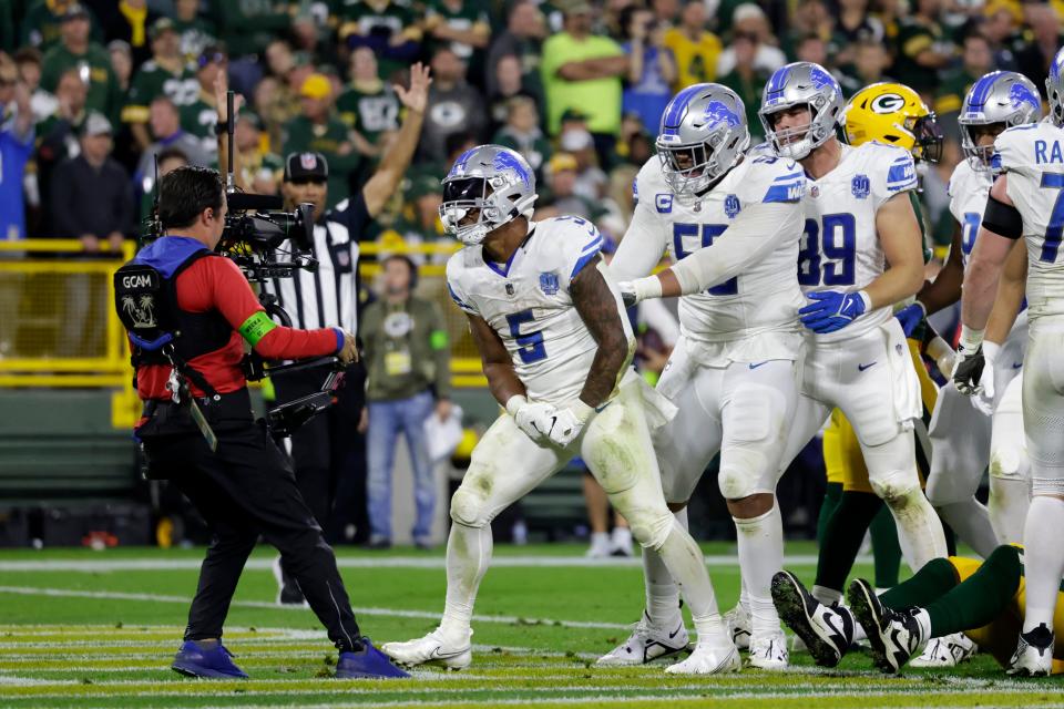 Detroit Lions running back David Montgomery (5) celebrates after a 1-yard touchdown run during the second half against the Green Bay Packers at Lambeau Field in Green Bay, Wisconsin, on Thursday, Sept. 28, 2023.