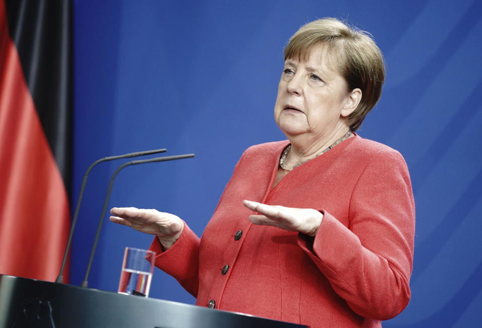 German Chancellor Angela Merkel addresses the media during a press conference in Berlin, Germany, Friday, June 19, 2020 after video meeting with the members of the European Council. (Kay Nietfeld/DPA via AP, Pool)