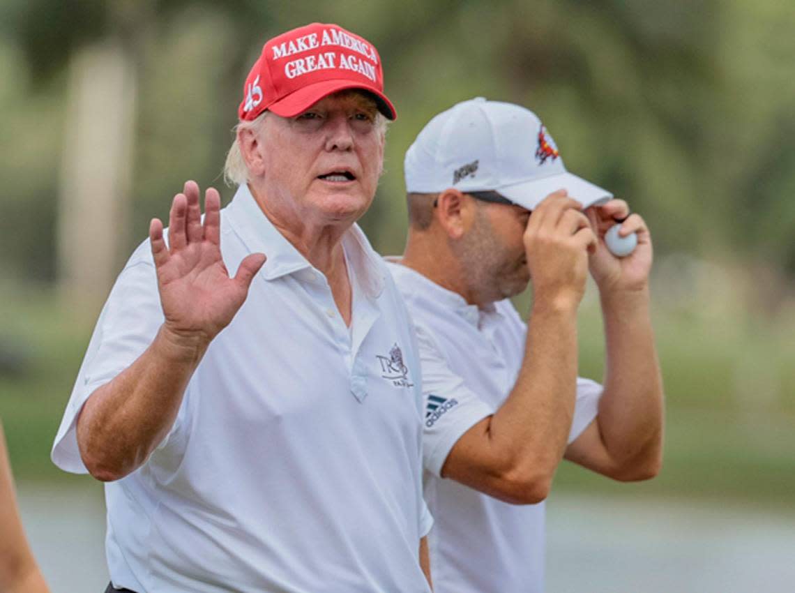 Former President Donald Trump waves as he leaves the 18th hole during the LIV Golf Miami Team Championship Pro-Am Tournament at Trump National Doral Golf Club in Doral on Thursday, October 27, 2022.