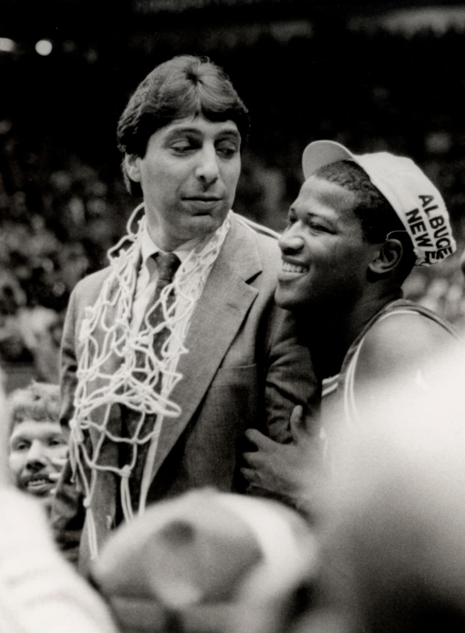 North Carolina State head coach Jim Valvano celebrates with his team after a victory over Houston in the 1983 Final Four.