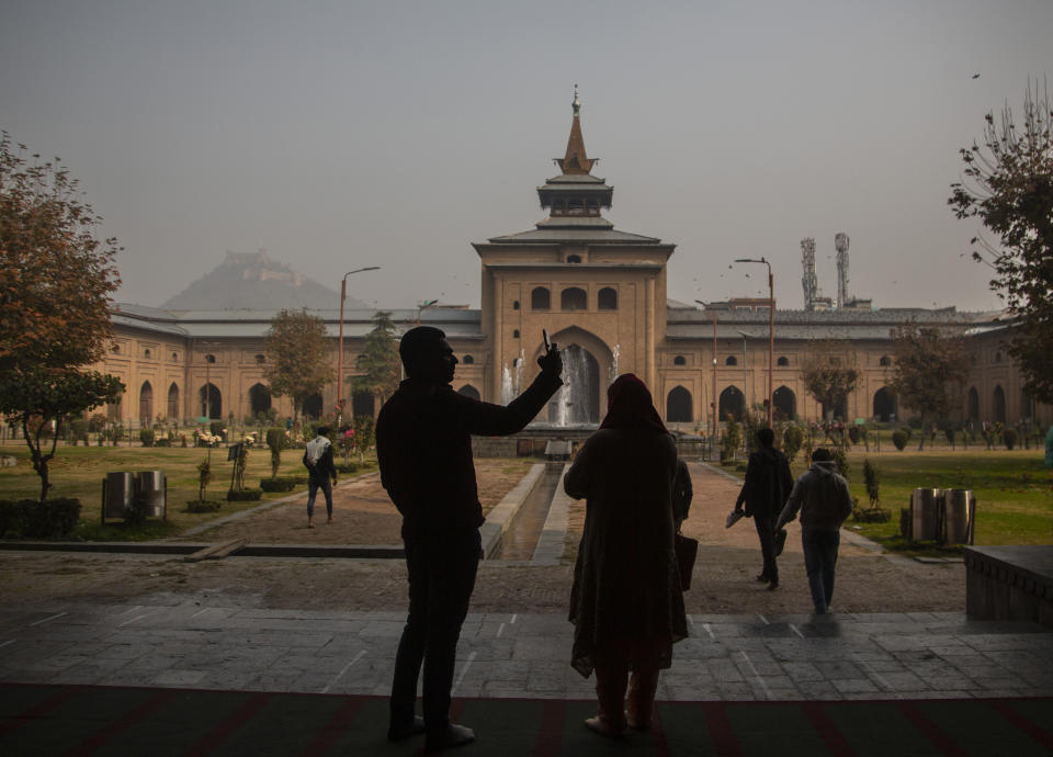 Indian tourists visit the Jamia Masjid, or the grand mosque in Srinagar, Indian controlled Kashmir, Nov. 13, 2021. The mosque has remained out of bounds to worshippers for prayers on Friday – the main day of worship in Islam. Indian authorities see it as a trouble spot, a nerve center for anti-India protests and clashes that challenge New Delhi’s sovereignty over disputed Kashmir. For Kashmiri Muslims it is a symbol of faith, a sacred place where they offer not just mandatory Friday prayers but also raise their voice for political rights. (AP Photo/Mukhtar Khan)