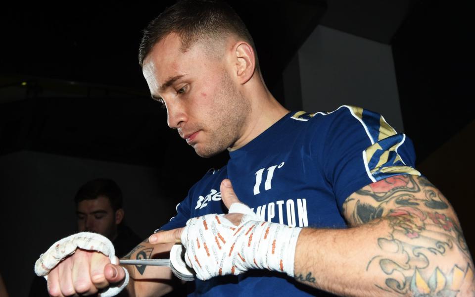 Carl Frampton tapes up his hands  - GETTY IMAGES