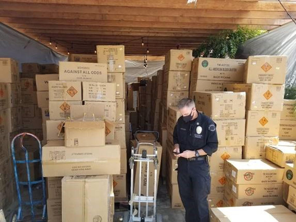 This July 2021 photo released by the ATF/United States Attorney's Office Central District of California, shows boxes of illegal large homemade fireworks explosives in South Los Angeles. Authorities found over 500 boxes of commercial grade fireworks in large cardboard boxes. A 27-year-old man was charged Saturday, July 3, 2021 with illegally transporting tons of explosives he purchased in Nevada — including several that left a trail of destruction and injuries after they blew up in a Los Angeles neighborhood. Arturo Ceja III faces the federal charges, according to the U.S. Attorney's office in Los Angeles. (ATF/United States Attorney's Office Central District of California via AP)