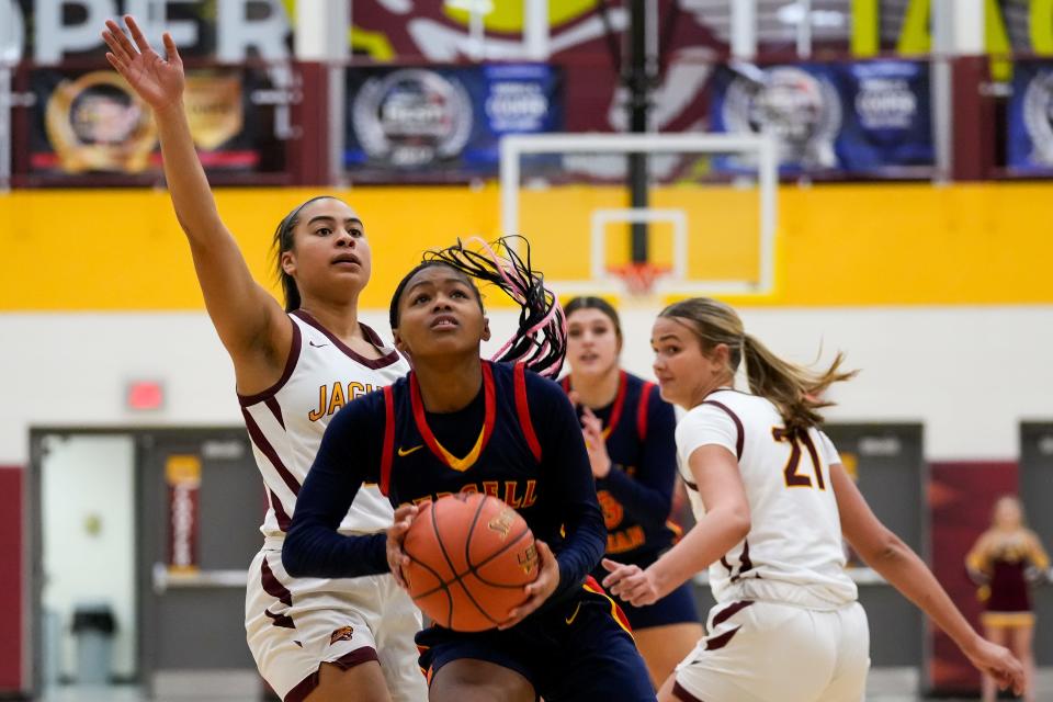 Purcell Marian guard Ky’Aira Miller looks to shoot at Cooper High School, Dec. 12, 2023, in Union, Ky.