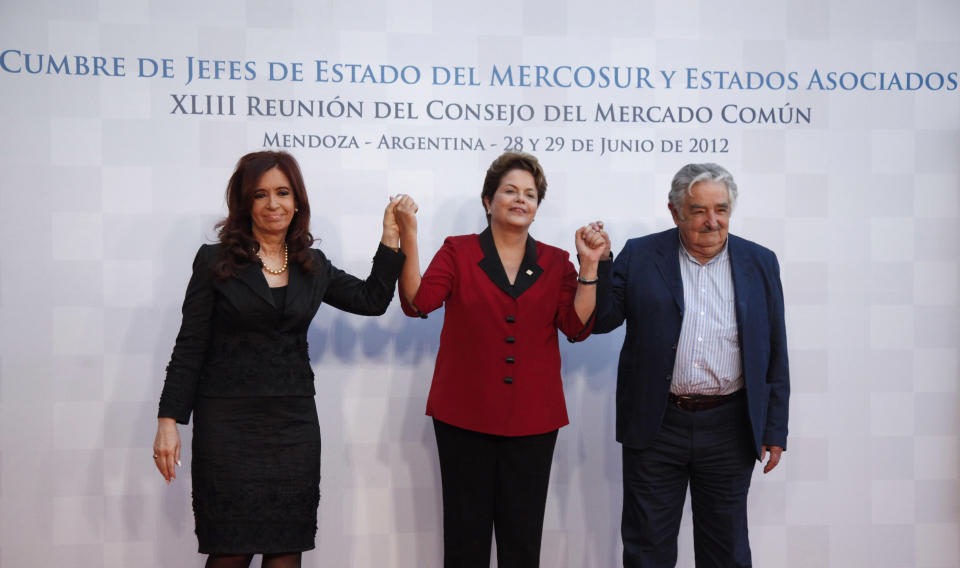 Argentina's President Cristina Fernandez, left, Brazil's President Dilma Rousseff, center, and Uruguay's President Jose Mujica pose for a picture at the Mercosur summit in Mendoza, Argentina, Friday, June 29, 2012. Paraguay could be suspended from the Mercosur regional trade bloc over last week's ouster of former President Fernando Lugo. The final decision will be announced Friday following a meeting of regional heads of state. (AP Photo/Natacha Pisarenko)