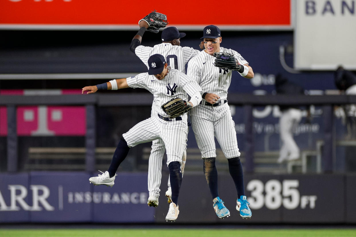 BRONX, NY - SEPTEMBER 22: New York Yankees left fielder Oswaldo Cabrera (95), center fielder Estevan Florial (90), and right fielder Aaron Judge (99) celebrate after the final out during a team victory in a game between the Arizona Diamondbacks and New York Yankees on September 22, 2023 at Yankee Stadium in the Bronx, New York. (Photo by Brandon Sloter/Icon Sportswire via Getty Images)