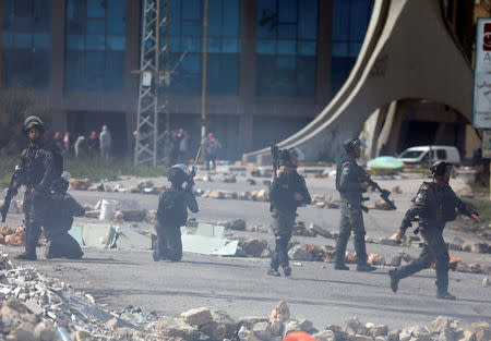 Israeli border police take position during clashes with Palestinian protesters near the Jewish settlement of Beit El, in the Israeli-occupied West Bank March 20, 2019. REUTERS/Mohamad Torokman