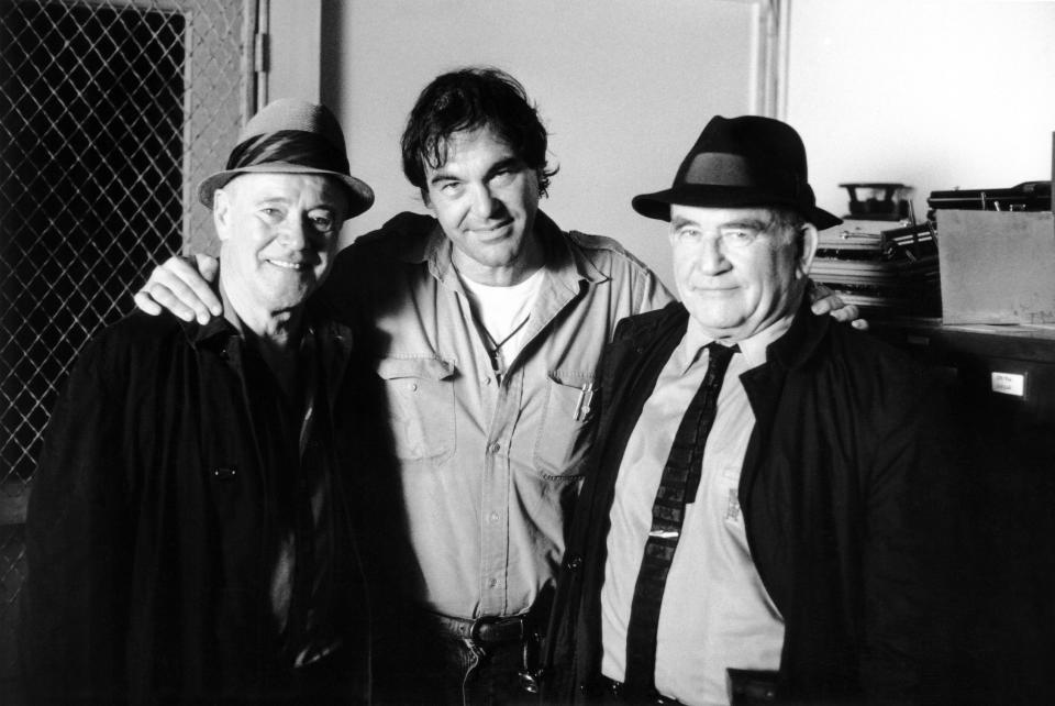 Jack Lemmon, director Oliver Stone, and Ed Asner on the set of 'JFK.'