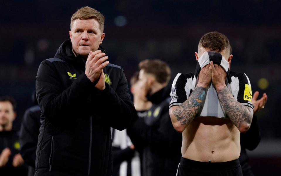 Newcastle United manager Eddie Howe cheers on the fans as Kieran Trippier looks dejected after the match