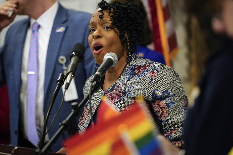 FILE - In this Wednesday, Feb. 19, 2020 file photo, Kentucky state Rep. Attica Scott speaks at a rally held by Fairness Campaign to advance LGTBQ rights, in the Rotunda at the State Capitol in Frankfort, Ky. State Rep. Attica Scott was arrested and charged Thursday evening, Sept. 24, 2020 with first-degree rioting, a felony, and two misdemeanor counts: unlawful assembly and failure to disperse.(AP Photo/Bryan Woolston, File)