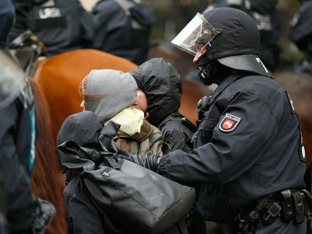 Police arrest activists during a demonstration against anti-immigration party rgw Alternative for Germany (AfD) before its convention in Cologne on 22 April: Reuters