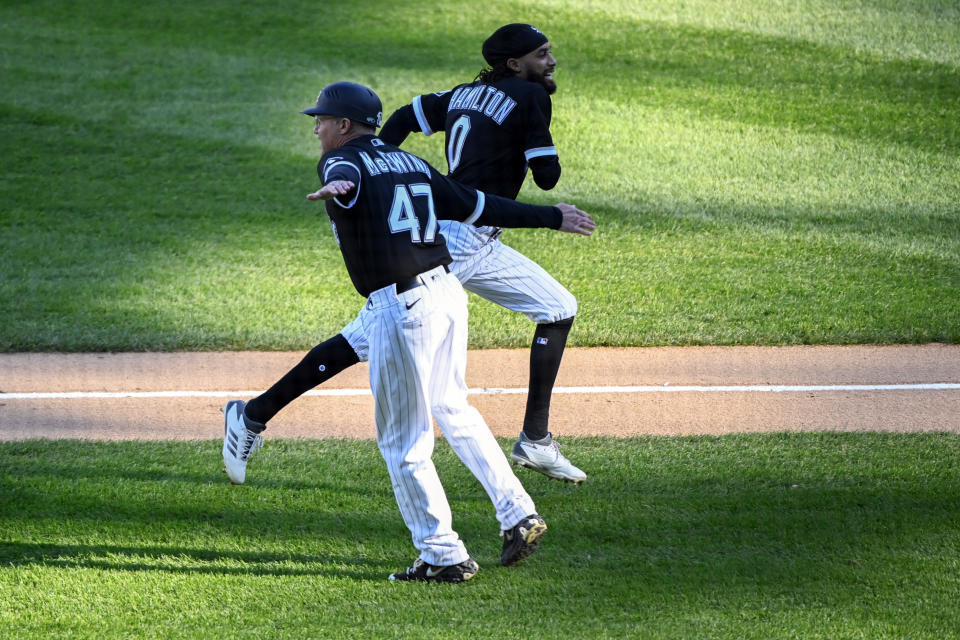 Chicago White Sox's Billy Hamilton (0) high-fives third base coach Joe McEwing (47) after hitting a home run during the fourth inning of the second baseball game of a doubleheader against the Baltimore Orioles, Saturday, May 29, 2021, in Chicago. (AP Photo/Matt Marton)