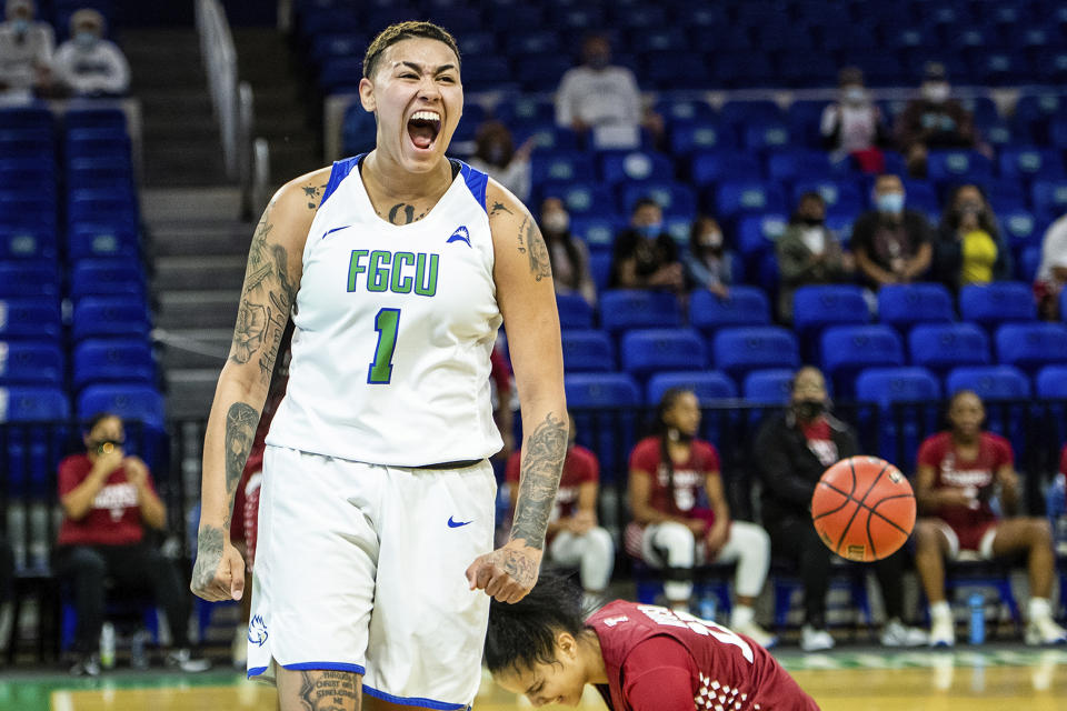 In this photo provided by Florida Gulf Coast University (FGCU) Kierstan Bell celebrates after a play against Temple, Dec. 6, 2020, in Fort Myers, Fla. FGCU transfer Bell is fifth in the nation in scoring at more than 25 points per game, and has the Eagles poised for another run at the NCAA tournament. (Brad Young/Florida Gulf Coast University via AP)