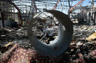 <p>A forensic expert inspects the destroyed funeral hall two days after a deadly Saudi-led airstrike targeted it, in Sanaa, Yemen, Monday, Oct. 10, 2016. (AP Photo/Hani Mohammed)</p>