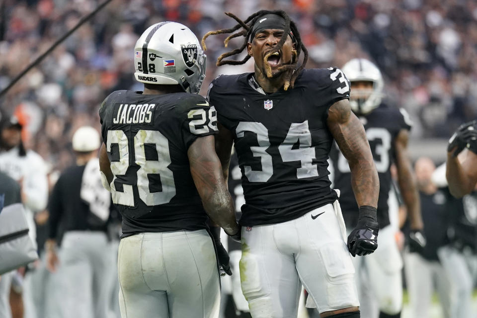 Las Vegas Raiders running back Josh Jacobs (28) celebrates his touchdown with running back Brandon Bolden (34) against the Denver Broncos during the second half of an NFL football game, Sunday, Oct. 2, 2022, in Las Vegas. (AP Photo/Abbie Parr)