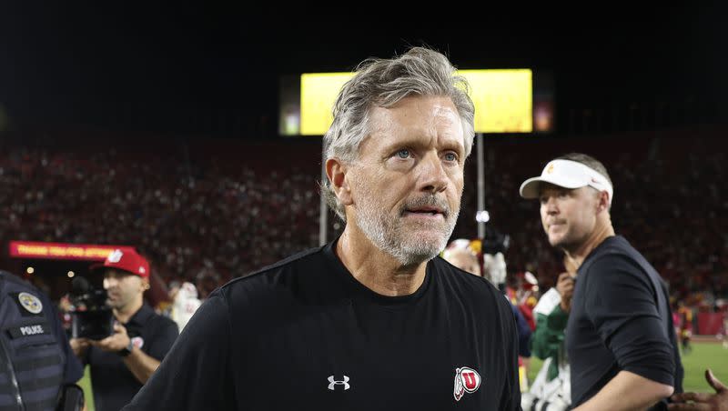 Utah Coach Kyle Whittingham walks away after being congratulated by USC Coach Lincoln Riley after Utah’s win at the Los Angeles Memorial Coliseum on Saturday, Oct. 21, 2023.