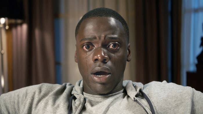 Daniel Kaluuya as Chris, sitting in a chair, frozen, tears streaming down his face