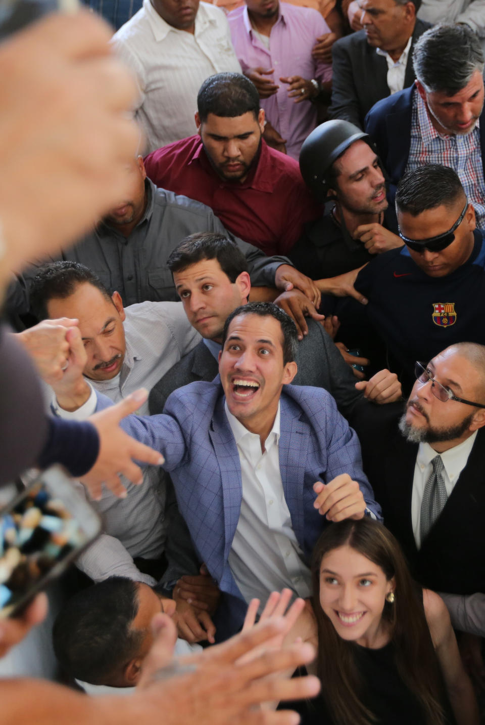 Venezuelan National Assembly President Juan Guaid&oacute; greets supporters in the Hatillo municipality of Caracas, Venezuela, on March 14, 2019. Guaid&oacute; has declared himself interim president and demands new elections, arguing that President Nicol&aacute;s Maduro's re-election last year was invalid. (Photo: ASSOCIATED PRESS)