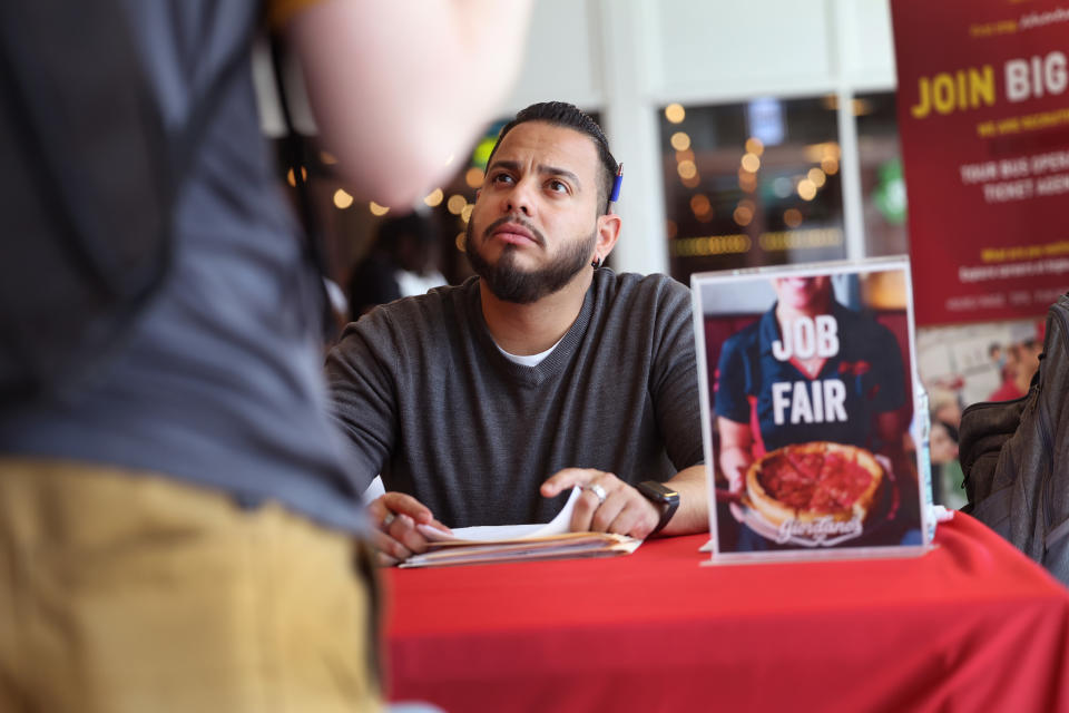 Will Janssen, general manager of Giordano&#39;s restaurant, interviews a job applicant during a job fair at Navy Pier on April 11, 2023 in Chicago. (Photo by Scott Olson/Getty Images)