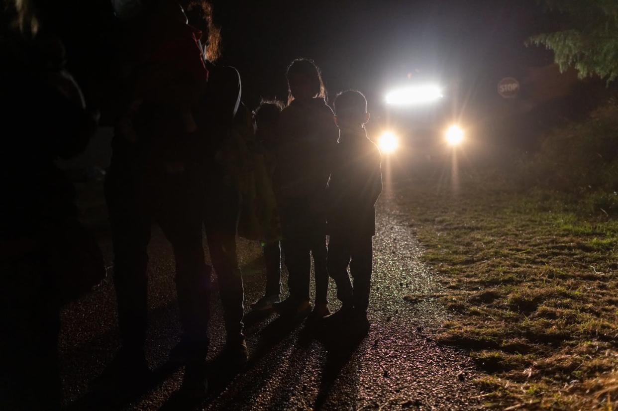 <span class="caption">Unaccompanied immigrant minors wait for Border Patrol processing after they crossed the Rio Grande into Roma, Texas, April 29, 2021. </span> <span class="attribution"><a class="link " href="https://www.gettyimages.com/detail/news-photo/unaccompanied-immigrant-minors-wait-to-be-processed-by-news-photo/1315252753?adppopup=true" rel="nofollow noopener" target="_blank" data-ylk="slk:John Moore/Getty Images;elm:context_link;itc:0;sec:content-canvas">John Moore/Getty Images</a></span>