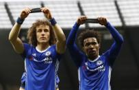 Britain Football Soccer - Manchester City v Chelsea - Premier League - Etihad Stadium - 3/12/16 Chelsea's Willian celebrates scoring their second goal with David Luiz as they hold armbands in respect for the victims of the Colombia plane crash containing the Chapecoense players and staff Action Images via Reuters / Jason Cairnduff Livepic
