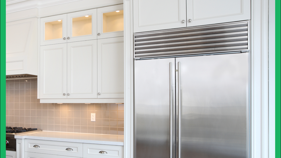 a kitchen with white cabinets