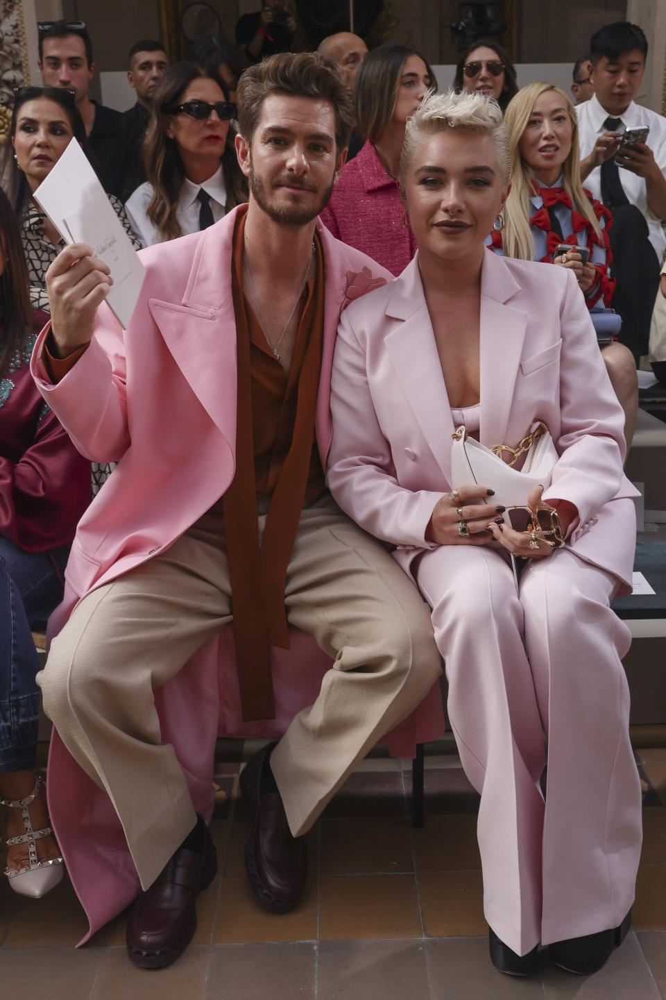 Andrew Garfield, left, and Florence Pugh attend the Valentino Spring/Summer 2024 womenswear fashion collection presented Sunday, Oct. 1, 2023 in Paris. (AP Photo/Vianney Le Caer)