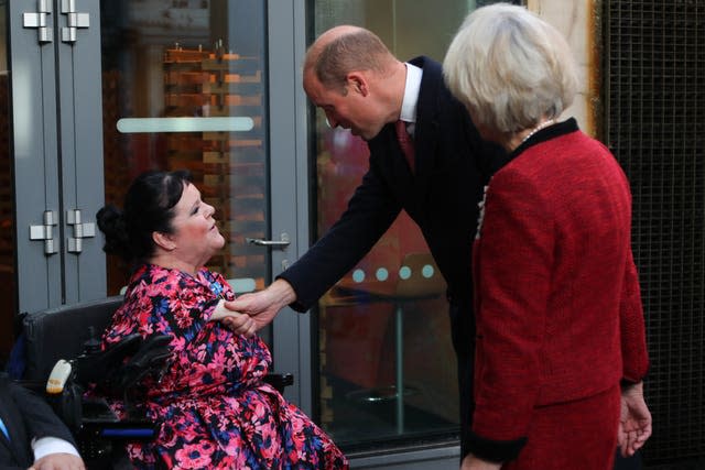 The Prince of Wales greets Rosaleen Moriarty Simmonds during a visit to the Senedd