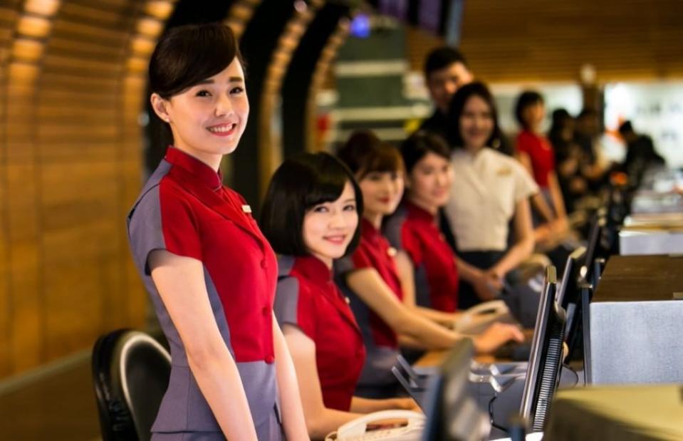 CAL ground staff at Taiwan Taoyuan Airport Check-in desks pose for a photograph. (Courtesy of China Airlines/Instagram)