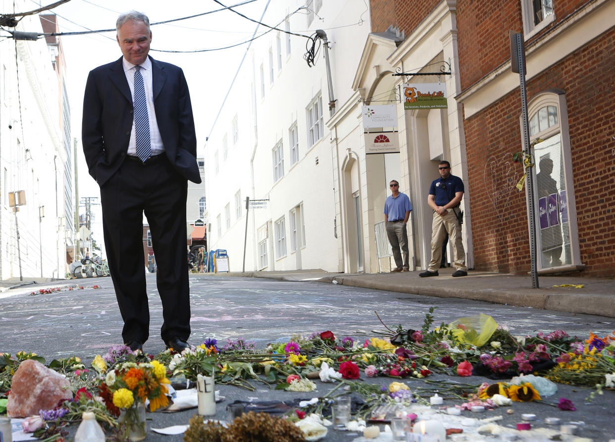 Sen. Tim Kaine visits a makeshift memorial Wednesday, Aug. 16, 2017, where Heather Heyer was killed Saturday when a car rammed into a crowd of people protesting a white nationalist rally Charlottesville, Va. (Photo: Julia Rendleman/AP)