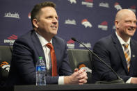 Denver Broncos general manager George Paton, left, deflects a question from a reporter as new head coach Nathaniel Hackett, right, looks on during a news conference to introduce Hackett, Friday, Jan. 28, 2022, at the NFL football team's headquarters in Englewood, Colo. (AP Photo/David Zalubowski)