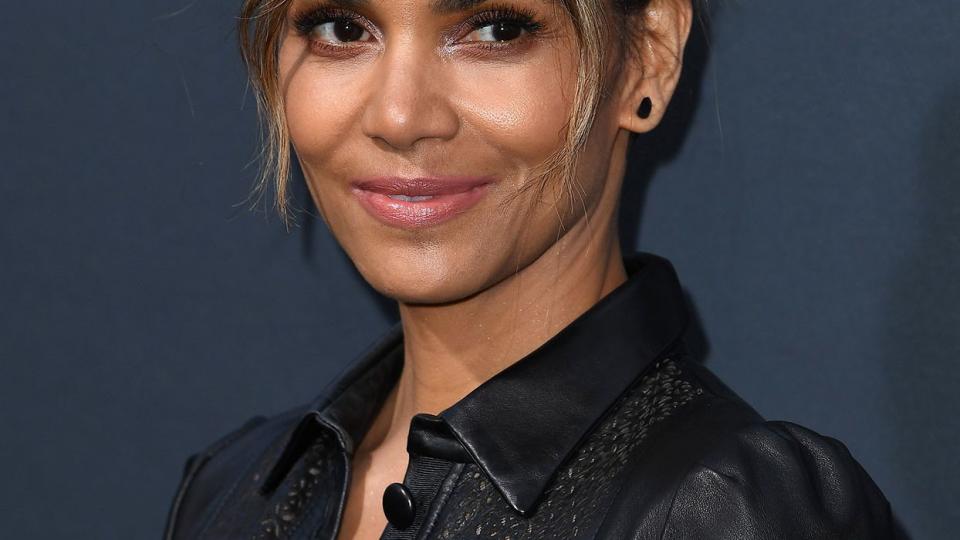 Halle Berry in an effortless bun and long curtain bangs.