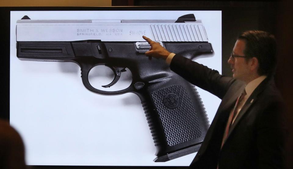 Assistant State Attorney Andrew Urbanak points to a photograph of a Smith & Wesson .40 caliber pistol during accused serial killer Robert Hayes' trial, Friday, Feb. 11, 2022, before Judge Raul Zambrano at the S. James Foxman Justice Center in Daytona Beach.