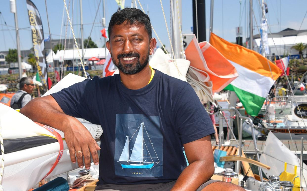 India's Abhilash Tomy poses on his boat