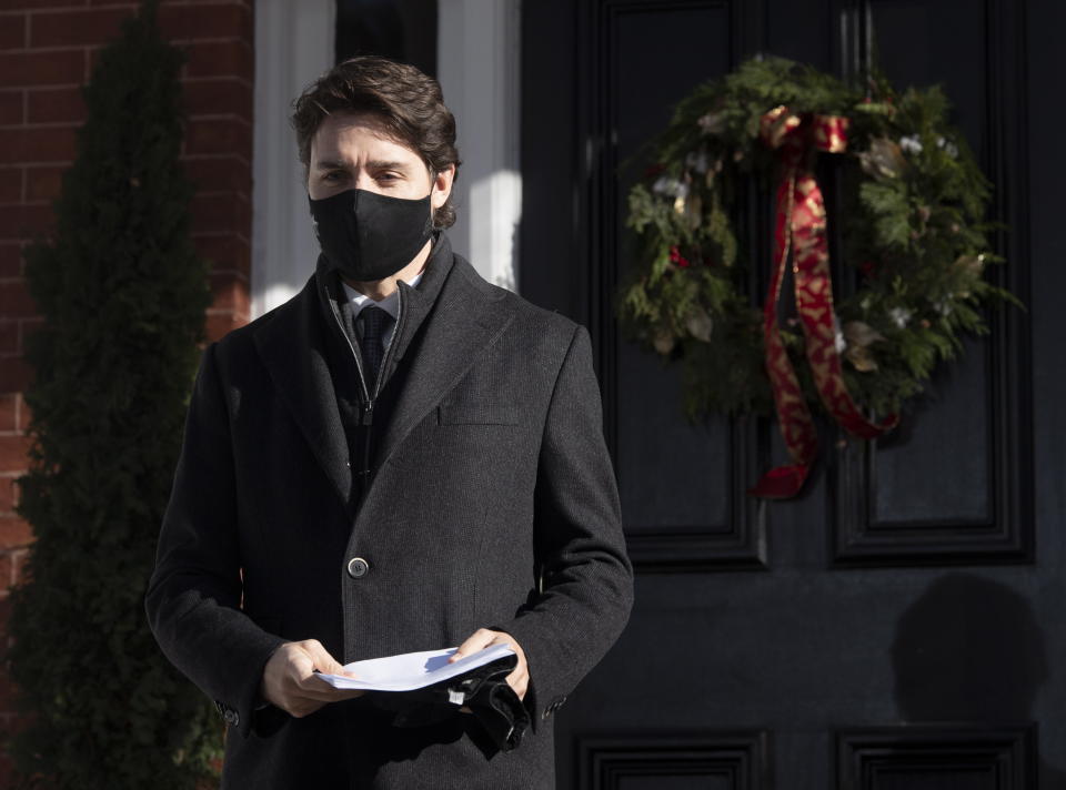 Prime Minister Justin Trudeau walk to the podium for a news conference outside of Rideau Cottage in Ottawa, Tuesday Nov. 24, 2020. (Adrian Wyld/The Canadian Press via AP)