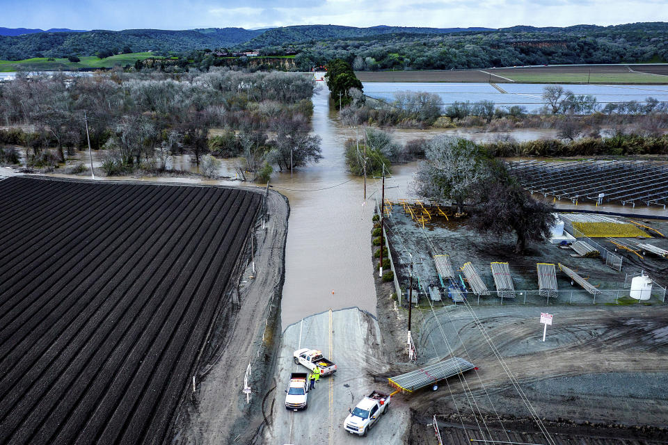 FILE - Floodwaters cover South Davis Rd. near Salinas in Monterey County, Calif., as the Salinas River overflows its banks on Jan. 13, 2023. California officials announced on Thursday, Jan. 26, 2023, that public water agencies will get 30% of what they asked for instead of 5%. The increase is because of a spate of recent storms that have helped replenish some of the state's reservoirs that had been impacted by a severe drought. (AP Photo/Noah Berger, File)