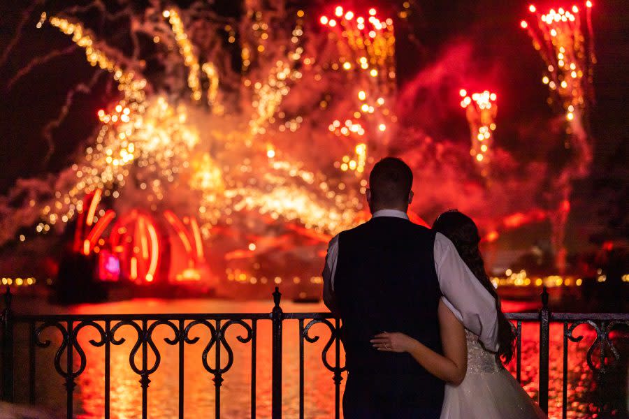 Bride Kristin Robinson, who is colorblind, closes out her wedding celebration by experiencing the EPCOT nighttime spectacular, “Harmonious” in color for the first time. Prior to her wedding on January 25, 2023, Robinson donned a special pair of glasses that enabled her to see color at Walt Disney World Resort in Lake Buena Vista, Fla. (Abigail Nilsson, photographer)