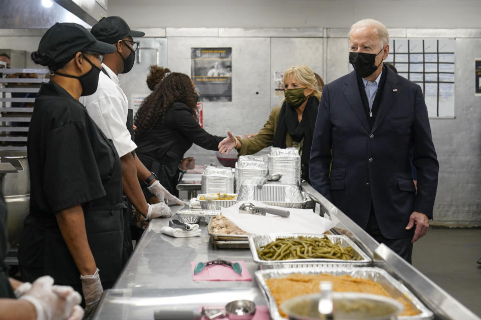 President Joe Biden and first lady Jill Biden arrive to assemble Thanksgiving meal kits during a visit to DC Central Kitchen in Washington, Tuesday, Nov. 23, 2021. (AP Photo/Susan Walsh)