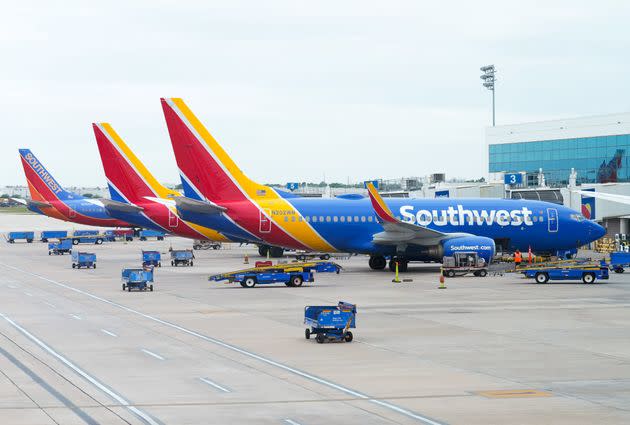 Southwest Airlines airplanes are shown in Houston. Authorities in Louisiana said the man was hospitalized Sunday after being apprehended on the tarmac of New Orleans' airport. 
