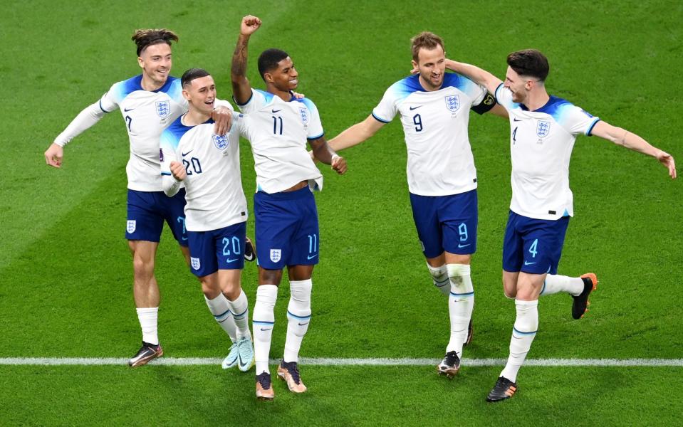 Marcus Rashford celebrates with Harry Kane of England after scoring their team's fifth goal during the FIFA World Cup Qatar 2022 Group B match - Getty Images