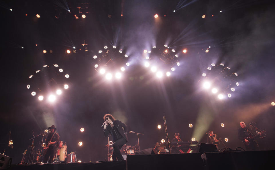 In this Sunday, March 17, 2019 photo, singer Enrique Bunbury performs at the Vive Latino music festival in Mexico City. The two-day rock festival is one of the most important and longest running of Mexico. (AP Photo/Christian Palma)