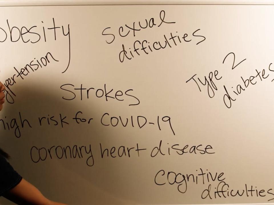 A white board has a variety of health issues that people have claimed can be helped by açaí written on it.