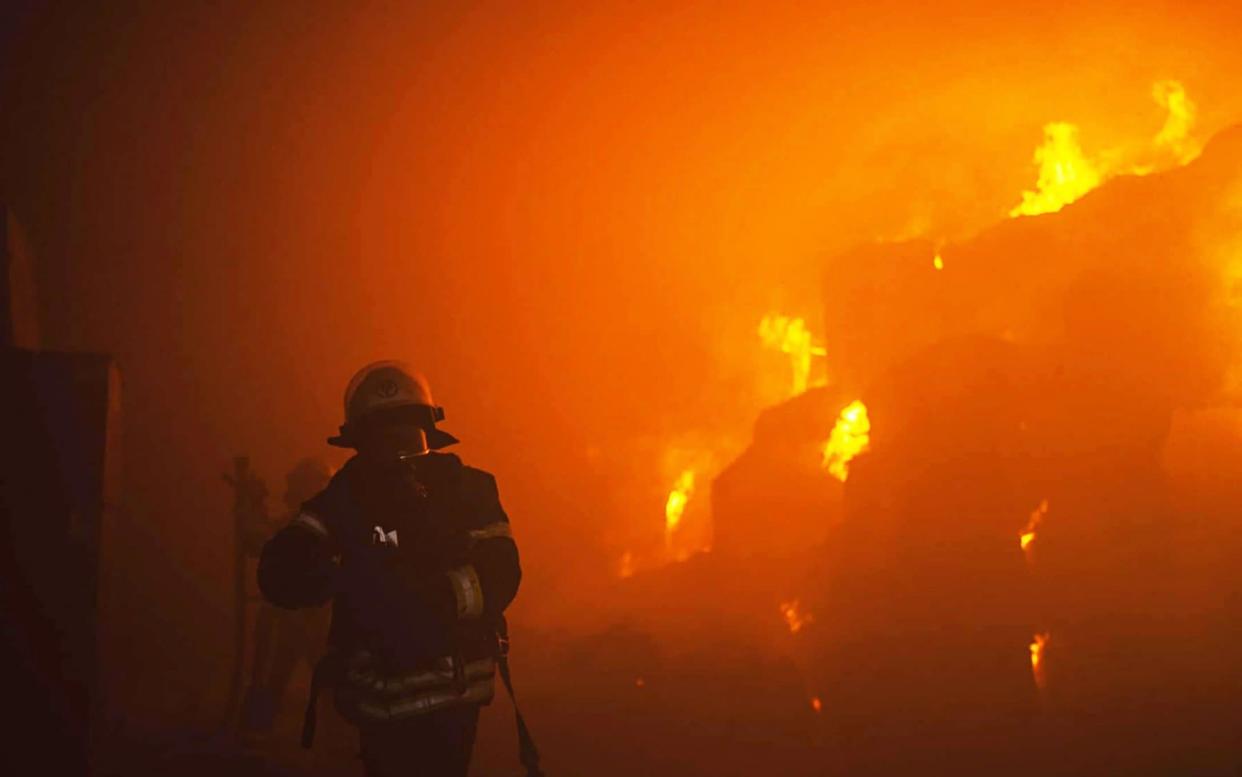 Emergency services tackling a fire after the drone attacks in Kyiv on May 28 - PAVLO PETROV/AFP