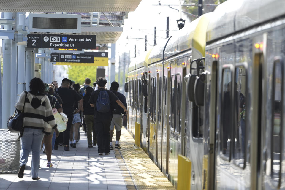 A Metro light rail train returns to service in Los Angeles, Tuesday, April 30, 2024. Officials say multiple people were hurt, and a few seriously, when a Metro light rail train and a University of Southern California shuttle bus collided in downtown Los Angeles. (AP Photo/Damian Dovarganes)
